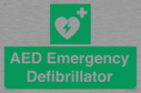 green-background-with-white-text-and-heart-defibrillator-symbol--white-cross-and~